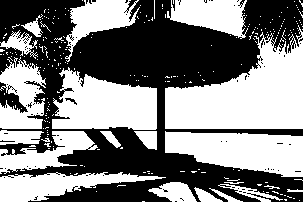 Beach lounge chairs under umbrella with palm trees and ocean view